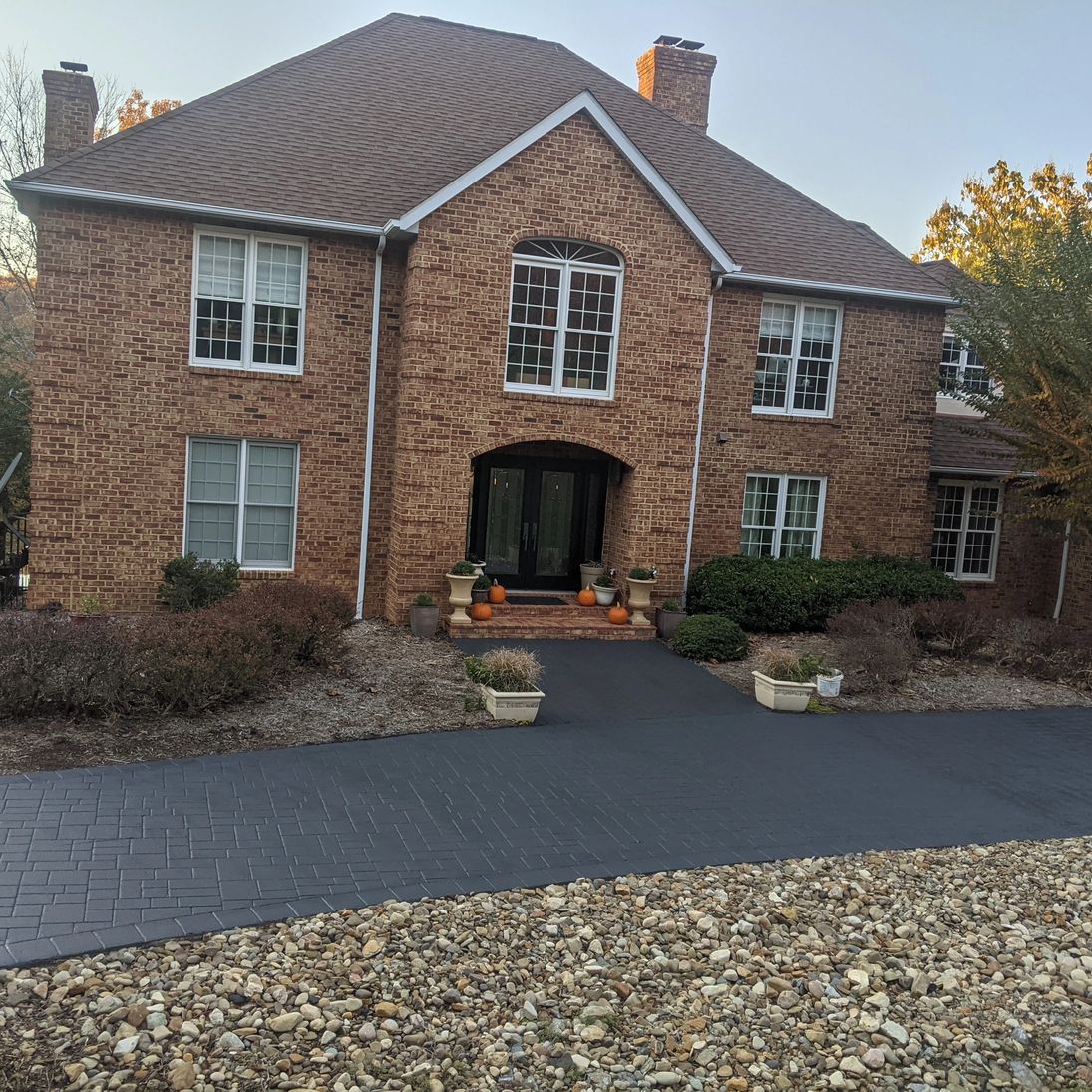 Driveway and concrete approach after cleaning and sealing